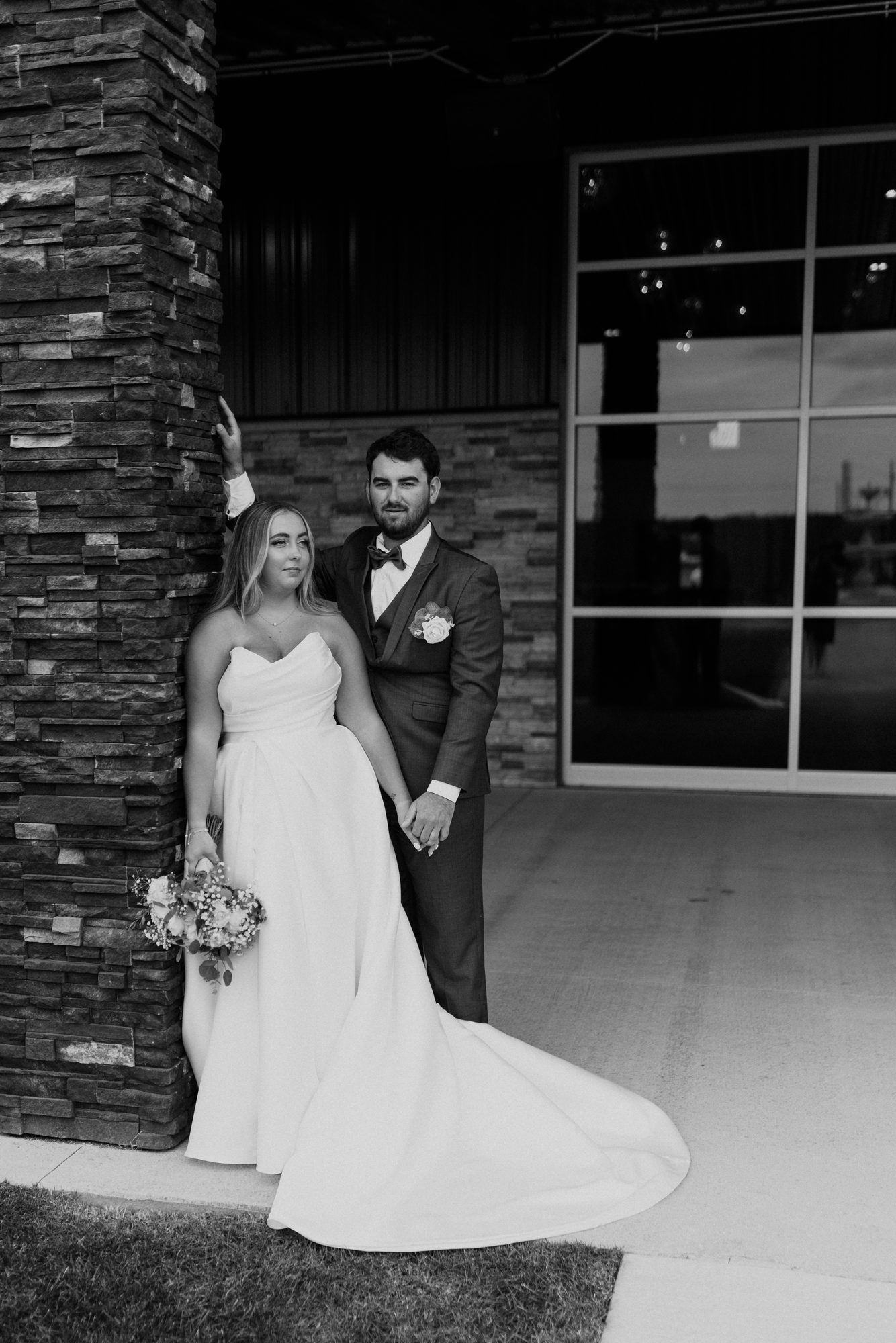 Newlyweds outside the venue at night