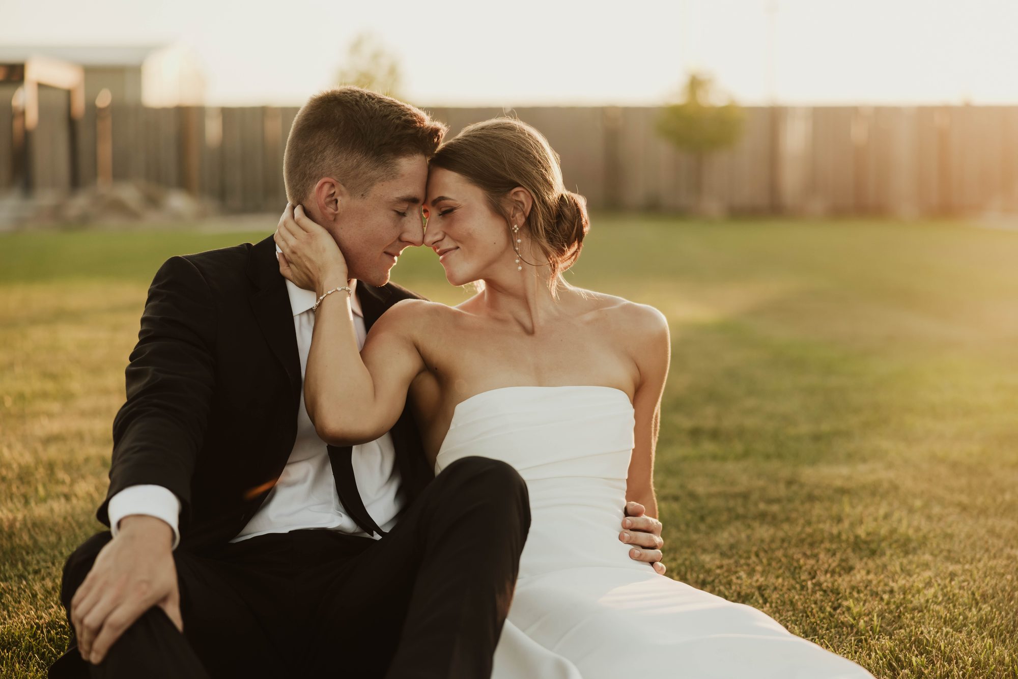 Newlyweds on the lawn at golden hour