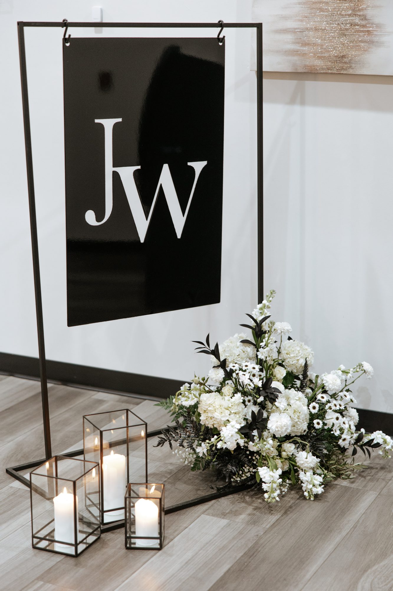 Custom monogram wall with lanterns and florals